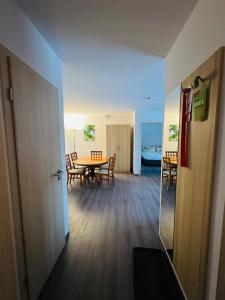 a room with a table and chairs and a dining room at Ferienhotel Alter Bahnhof garni in Prerow