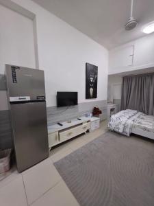 a large room with a bed and a television at Apartment in ajman in Ajman 
