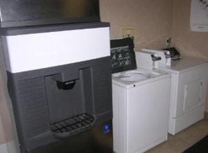 a kitchen with a counter with a coffee maker at Aderi Hotel Near Casino in Niantic