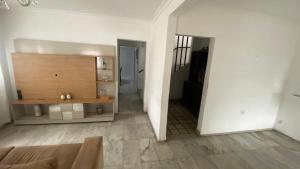 a living room with a couch and a table at Casa Carnaval Olinda 2026 in Recife