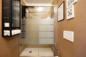 a shower with a glass door in a bathroom at Dal Cardinale in Novara +13 photos