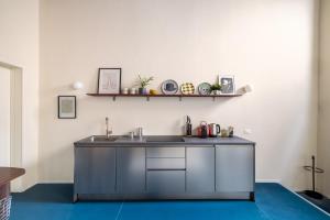 a kitchen with a sink and a counter at Dal Cardinale in Novara