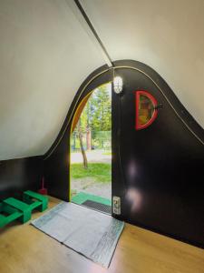 a room with a door with a window at Ermida Gerês Camping in Ermida