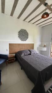 a bedroom with a large bed in a room at Complexo Luquinha in Delfinópolis +41 photos