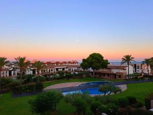 an aerial view of a resort with a swimming pool at Les Oliveres Beach in Perelló