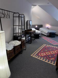 a room with two bunk beds and a desk at Gemütliches City-Appartment in Wentorf bei Hamburg