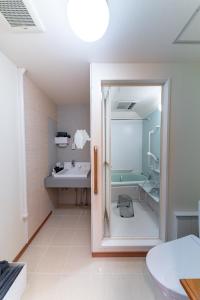 a bathroom with a shower and a sink at Kawasaki Central House in Kawasaki +53 photos
