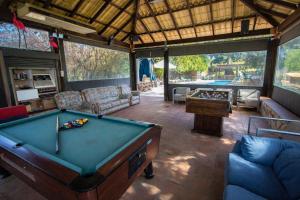 a pool table in the middle of a living room at Catalunya Casas An oasis for up to 26 nature loving guests! in Sils
