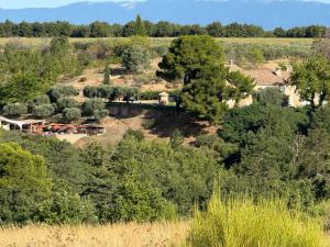 an aerial view of a farm with trees at Lodges en pleine nature in Riez +3 photos
