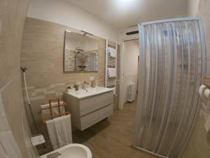 a bathroom with a sink and a toilet and a shower at B&B Ostello Villafranca in Pignola +71 photos
