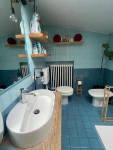 a bathroom with a sink and a toilet at San Clemente guest house in Padova +23 photos
