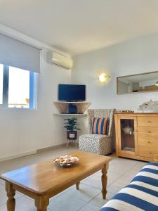 a living room with a coffee table and a couch at Bayview Apartment 106 in Albufeira