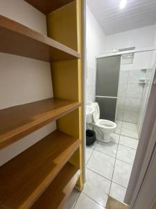 a small bathroom with a toilet and a shower at Bru&Mar Pousada in Parnaíba +39 photos