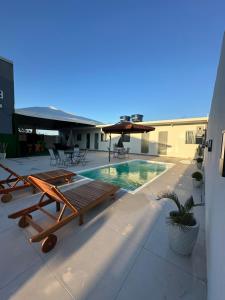 a swimming pool on the roof of a building at Casa Premium com Jacuzzi e Churrasqueira in Palhoça