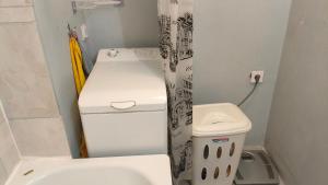 a small bathroom with a toilet and a sink at Vilde Apartment in Tallinn +7 photos