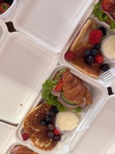 a plastic lunch box filled with food on a table at Pod Ratuszem in Rzeszów +24 photos