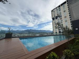 a large swimming pool on the side of a building at Apartment with pool on Paseo Santa Lucia in Monterrey