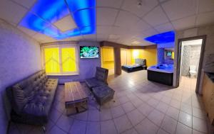 an overhead view of a living room with a couch and a table at Jacuzzi in Klaipėda
