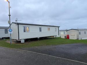 a house that is sitting on the side of a road at The Ellerton at Eyemouth in Eyemouth +3 photos