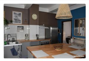 a kitchen with a sink and a counter top at Maison Terreaux in Vaux-en-Bugey