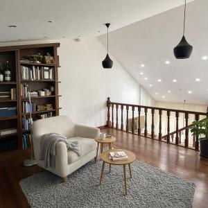 a living room with a chair and a table at Villa Lestedo in Lestedo
