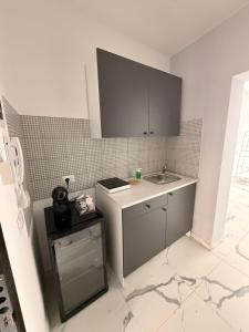 a kitchen with a sink and a counter top at Vulcano Rooms 3 in Catania