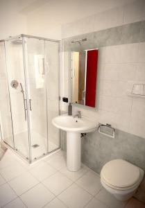 a bathroom with a shower and a sink and a toilet at B&B 31 mt dal Duomo in Benevento