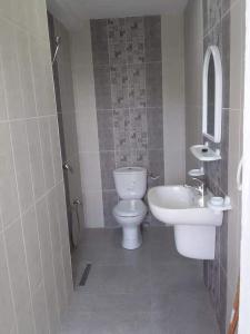 a bathroom with a toilet and a sink at CHEZ ALAA Kelibia in Kelibia +16 photos