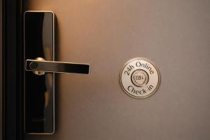a doorknob with a coin on the door at Waves 342 Infinity in Mamaia Sat/Năvodari