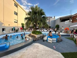a group of people in a swimming pool at Hotel Termal Rio Hondo in Termas de Río Hondo