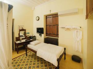 Postel nebo postele na pokoji v ubytování Casa Menezes - A Heritage Goan Homestay