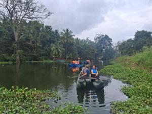 a group of people riding in a boat on a river at Villa Mossa Ambalangoda Boutique villa villa in Ambalangoda