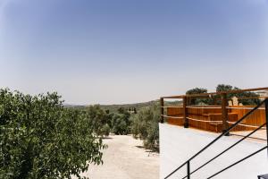 a view from the balcony of a house with trees at Alojamiento Rural con jacuzzi privado in Málaga