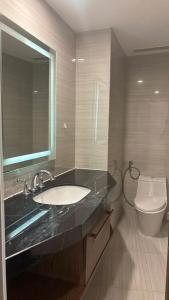 a bathroom with a sink and a toilet at Padorama in Nha Trang