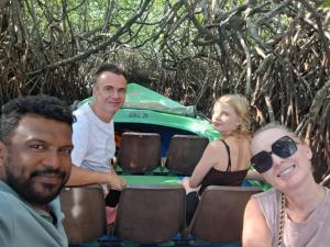 a group of people sitting in front of a car at Villa Mossa Ambalangoda Boutique villa villa in Ambalangoda