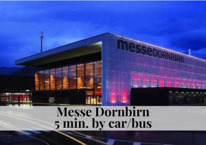 a building with the words message donation min min by car car bus at CROWN LIVING Babylon Studios Lustenau - Studios nahe Messe und Schweizer Grenze, WLAN, kostenloser Parkplatz, Self Check-in, ideal für Geschäftsreisende und Feriengäste in Lustenau