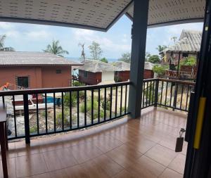 a view from the balcony of a house at Pimmada Hut in Haad Pleayleam