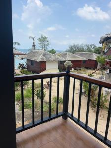 a view from the balcony of a house at Pimmada Hut in Haad Pleayleam