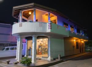 a building with a balcony on top of it at Sonic Villa,Beruwala in Beruwala