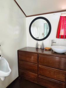 a bathroom with a sink and a mirror at Uros Killa Lodge in Puno