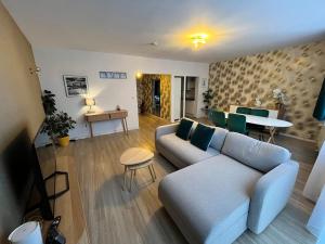 a living room with a couch and a table at Vilvoorde city center in Vilvoorde