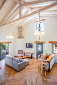 a living room with a couch and a table at Villa Dias by Elayan Villas Corfu in Karousádes