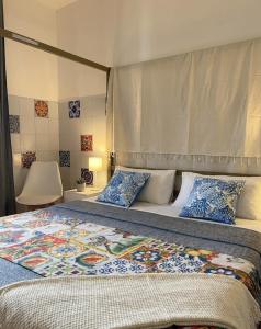a bedroom with a large bed with pillows at B&B RIO GRANDE in Massarosa +52 photos