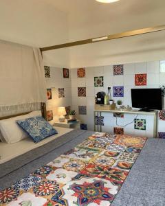 a bedroom with a bed with a rug on the floor at B&B RIO GRANDE in Massarosa