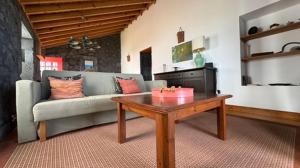 a living room with a couch and a coffee table at Casa de Santana in Santana