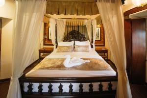 Postel nebo postele na pokoji v ubytování Casa Menezes - A Heritage Goan Homestay