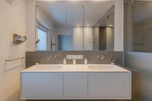 a bathroom with two sinks and a mirror at Home sweet Lux - 8P - House & garden - 280n m2 in Lorentzweiler +44 photos
