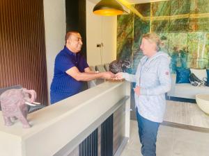 a man and a woman standing in a room at Monaara Leisure - Ella in Ella +26 photos