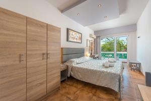 Posteľ alebo postele v izbe v ubytovaní Melody Studios Faliraki