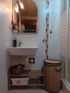 a bathroom with a sink and a mirror at O Cantinho de Góis in Góis +21 photos